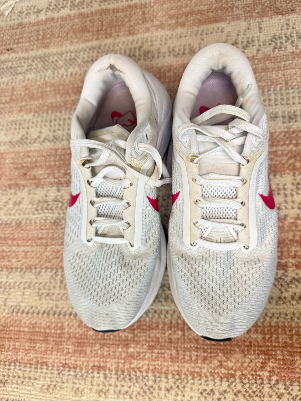 Nike White Sneakers with Pink Swoosh Accents